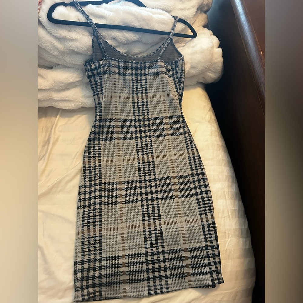it's a plaid grey black and brown tight dress.